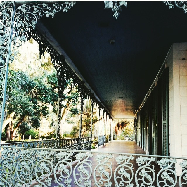 Intricate ironwork line the plantation's balcony.
